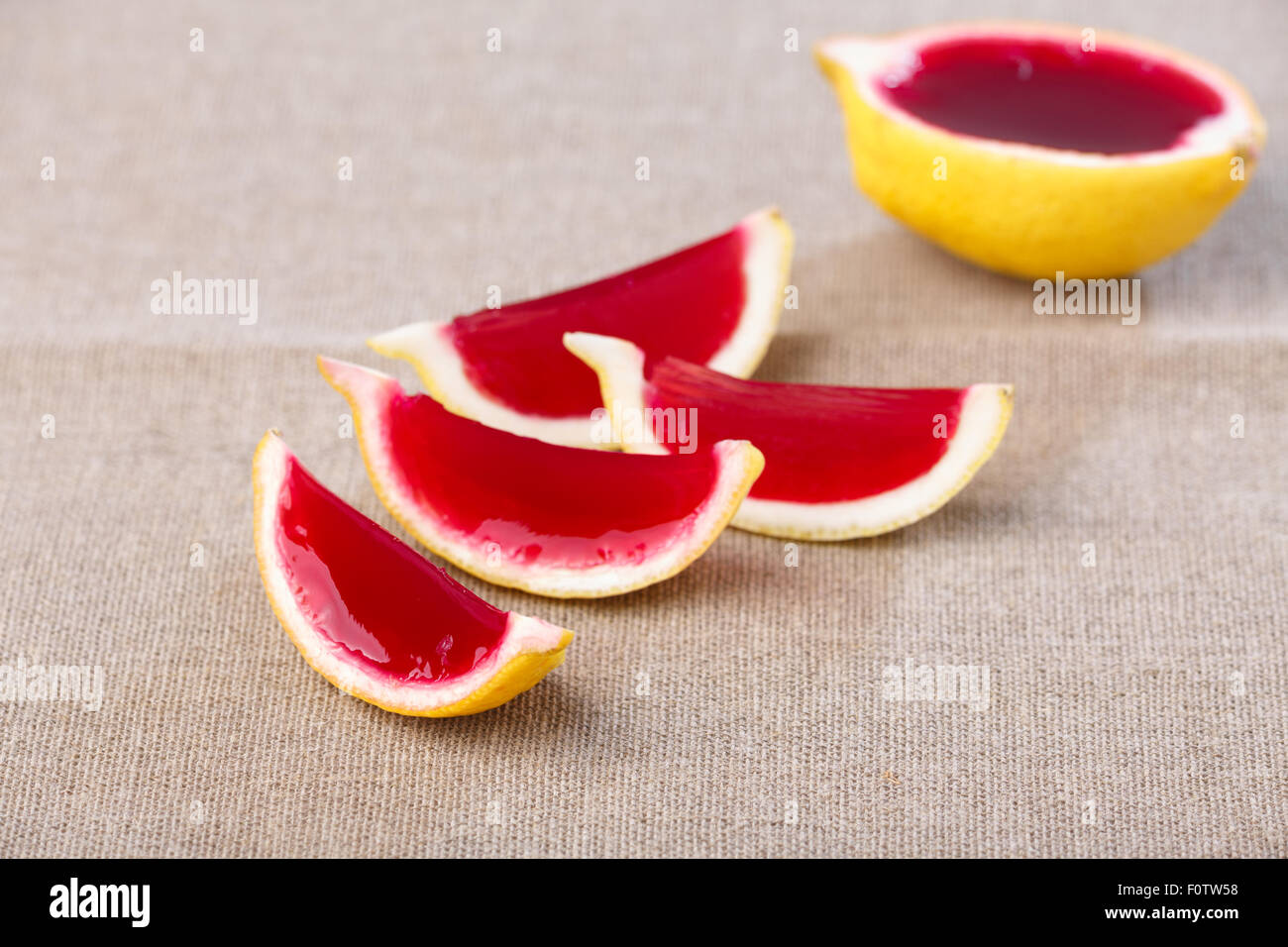 Lemon tequila strawberry jelly (jello) shots on a linen clothed table