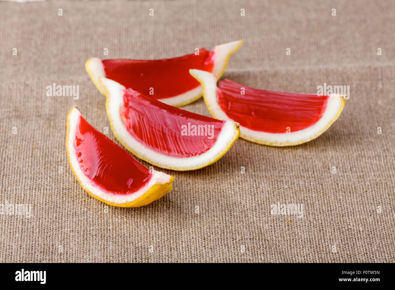 Lemon Tequila Strawberry Jelly jello Shots On A Linen Clothed Table 