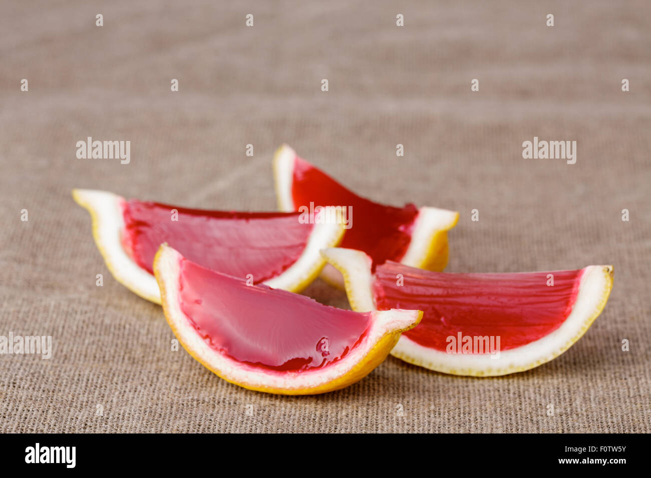 Lemon tequila strawberry jelly (jello) shots on a linen clothed table