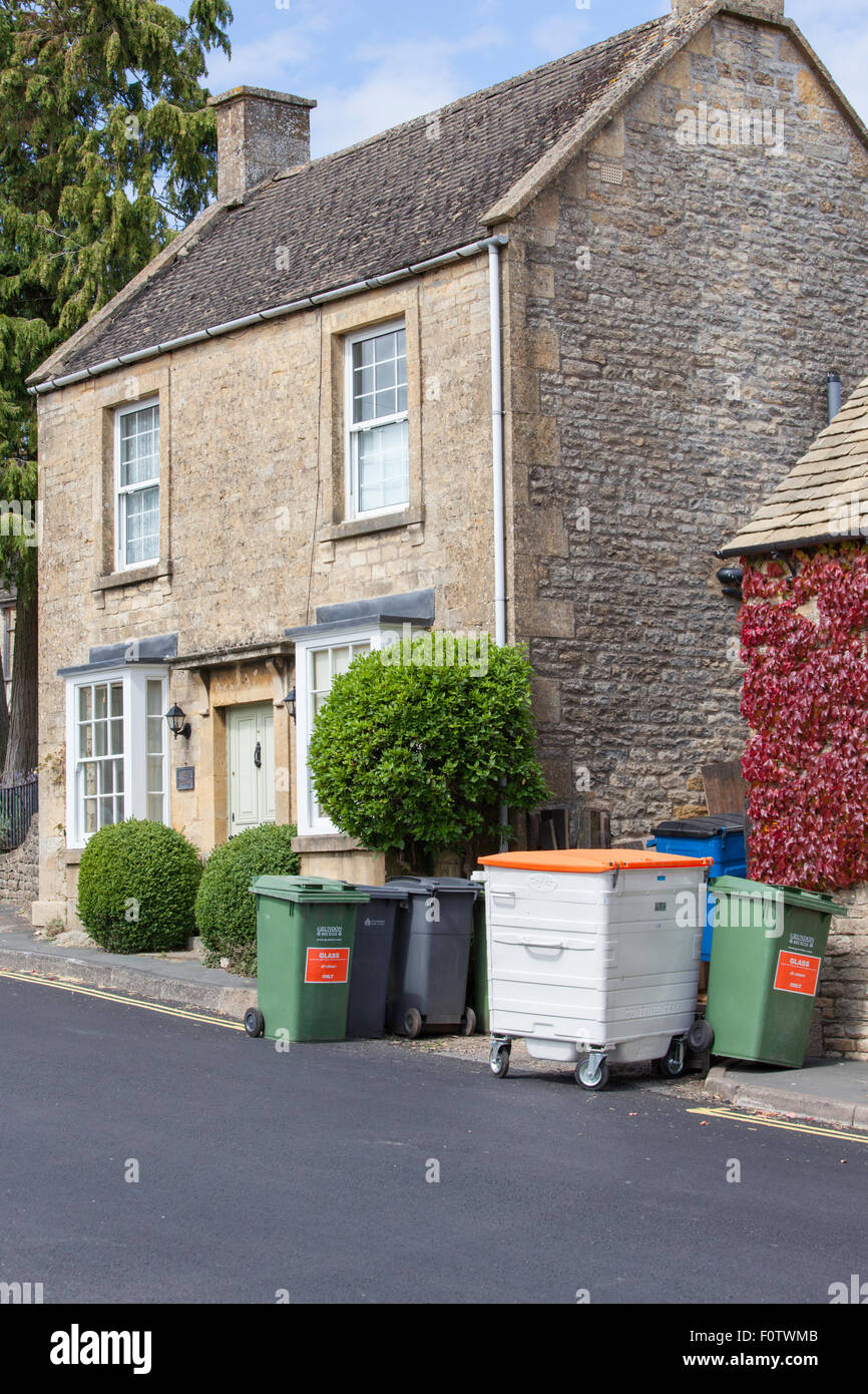 Rubbish bins outside a cottage in the Cotswolds, Gloucestershire