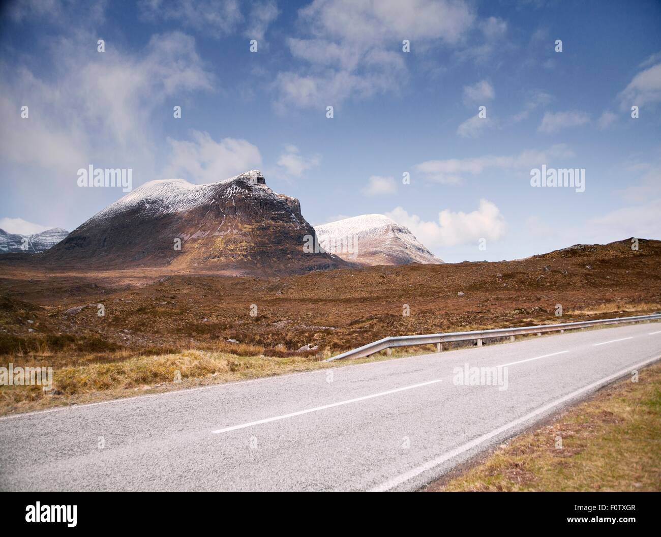 Road past Stac Pollaidh Mountain, Assynt, Scotland Stock Photo