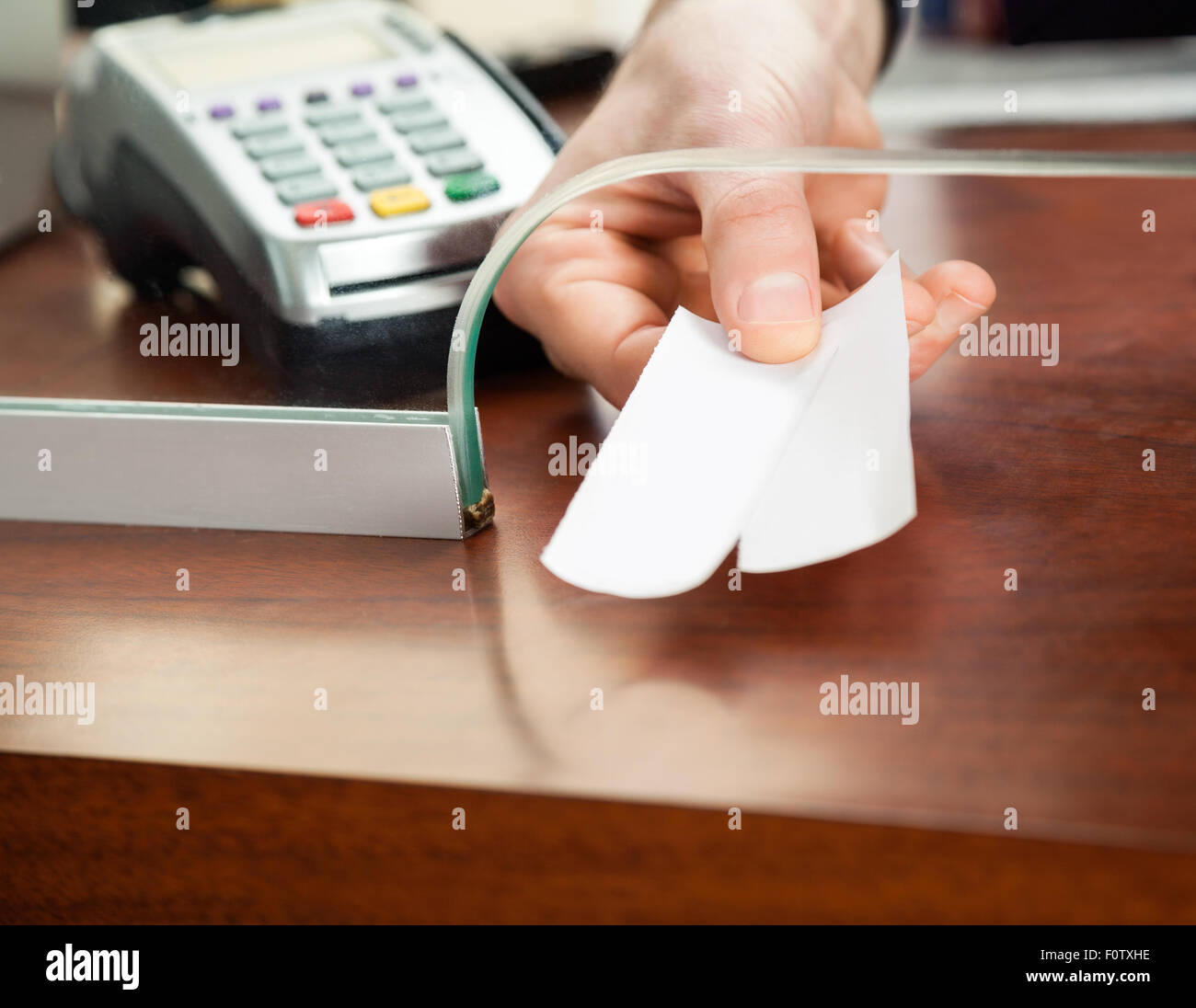 Worker's Hand Holding Tickets At Box Office Stock Photo Alamy