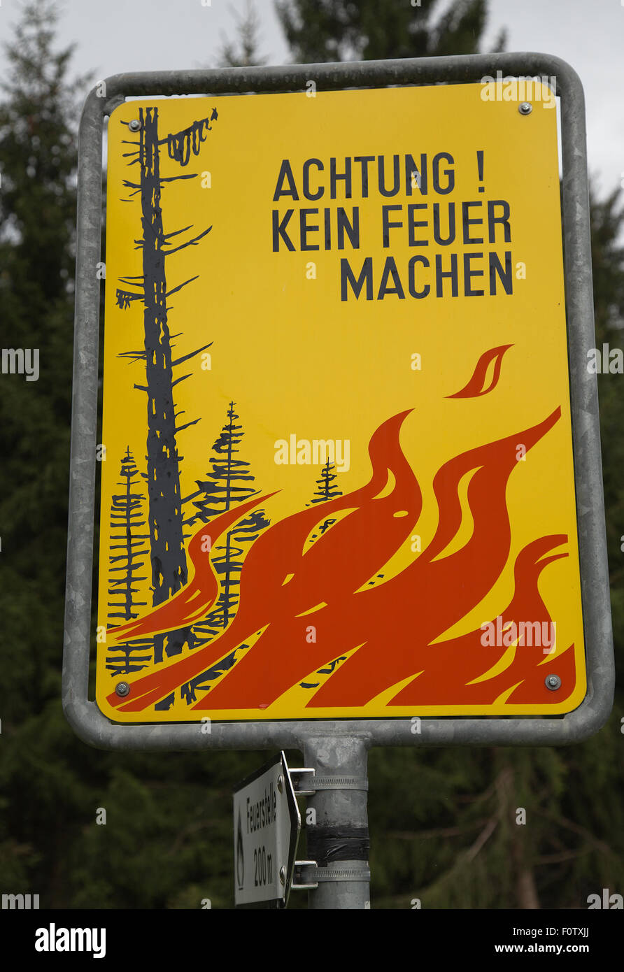 Sign warning against forest fires in Falera in Swiss Alps Stock Photo