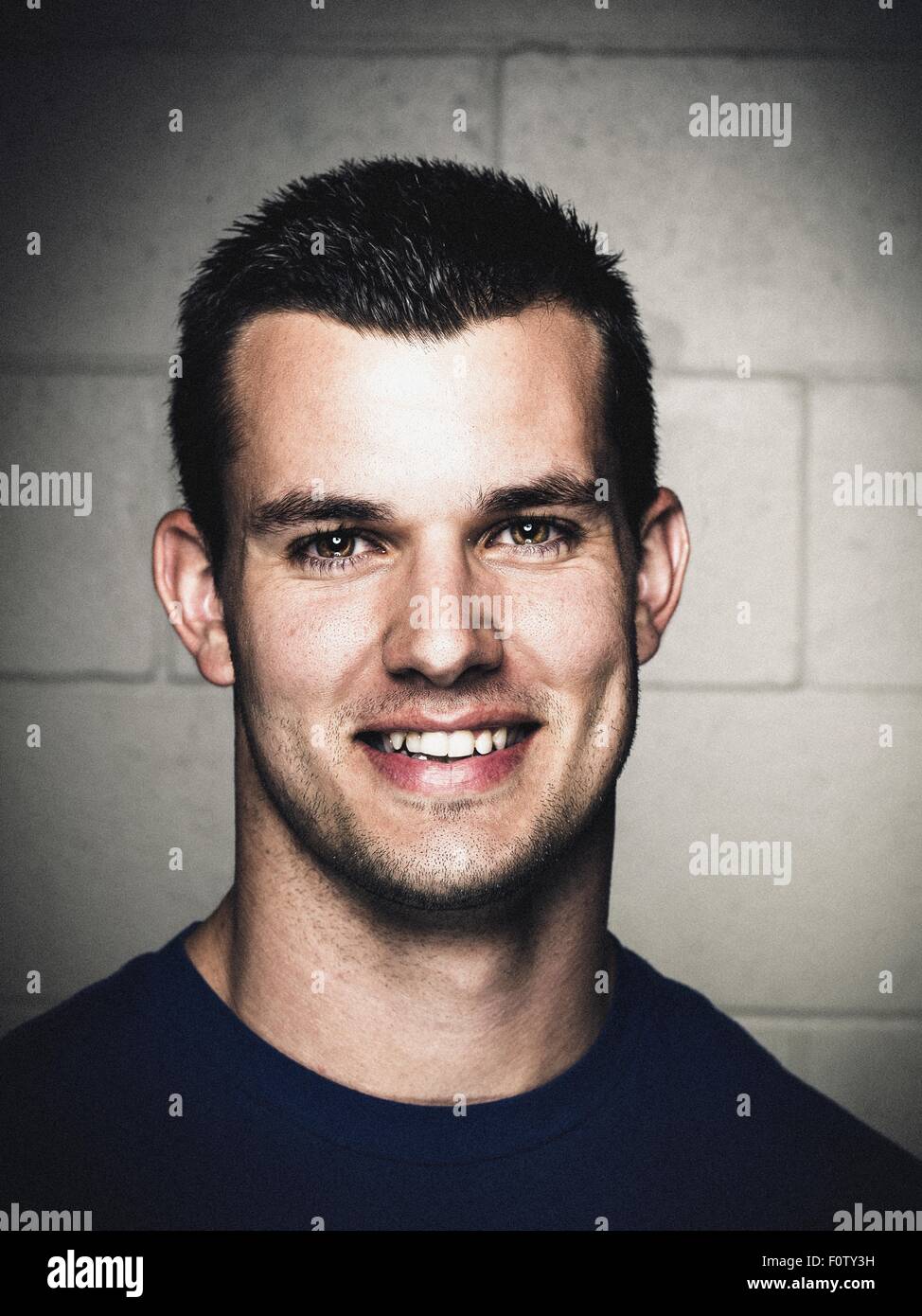 Portrait of smiling young man before workout Stock Photo
