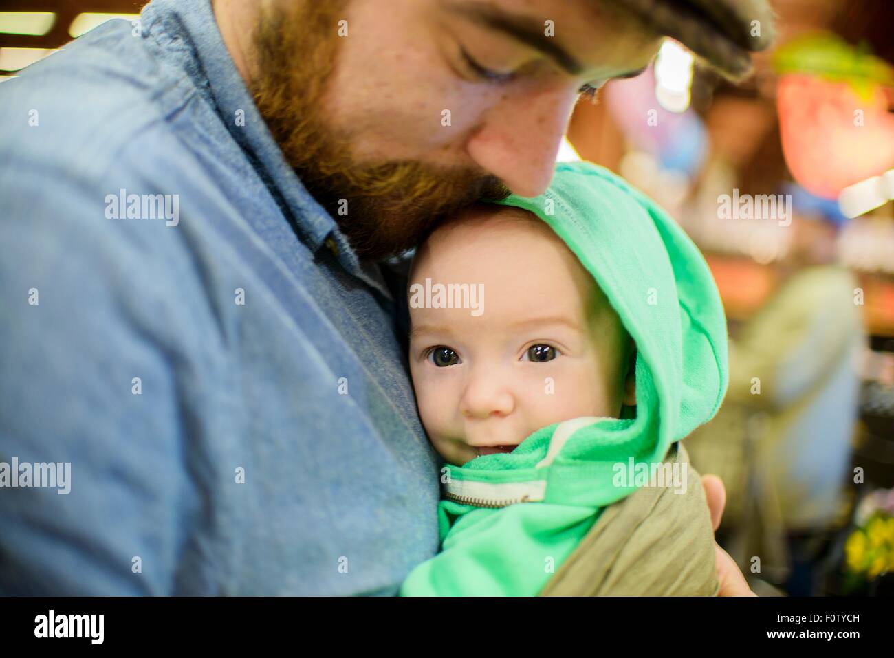 Father holding baby son, close up Stock Photo