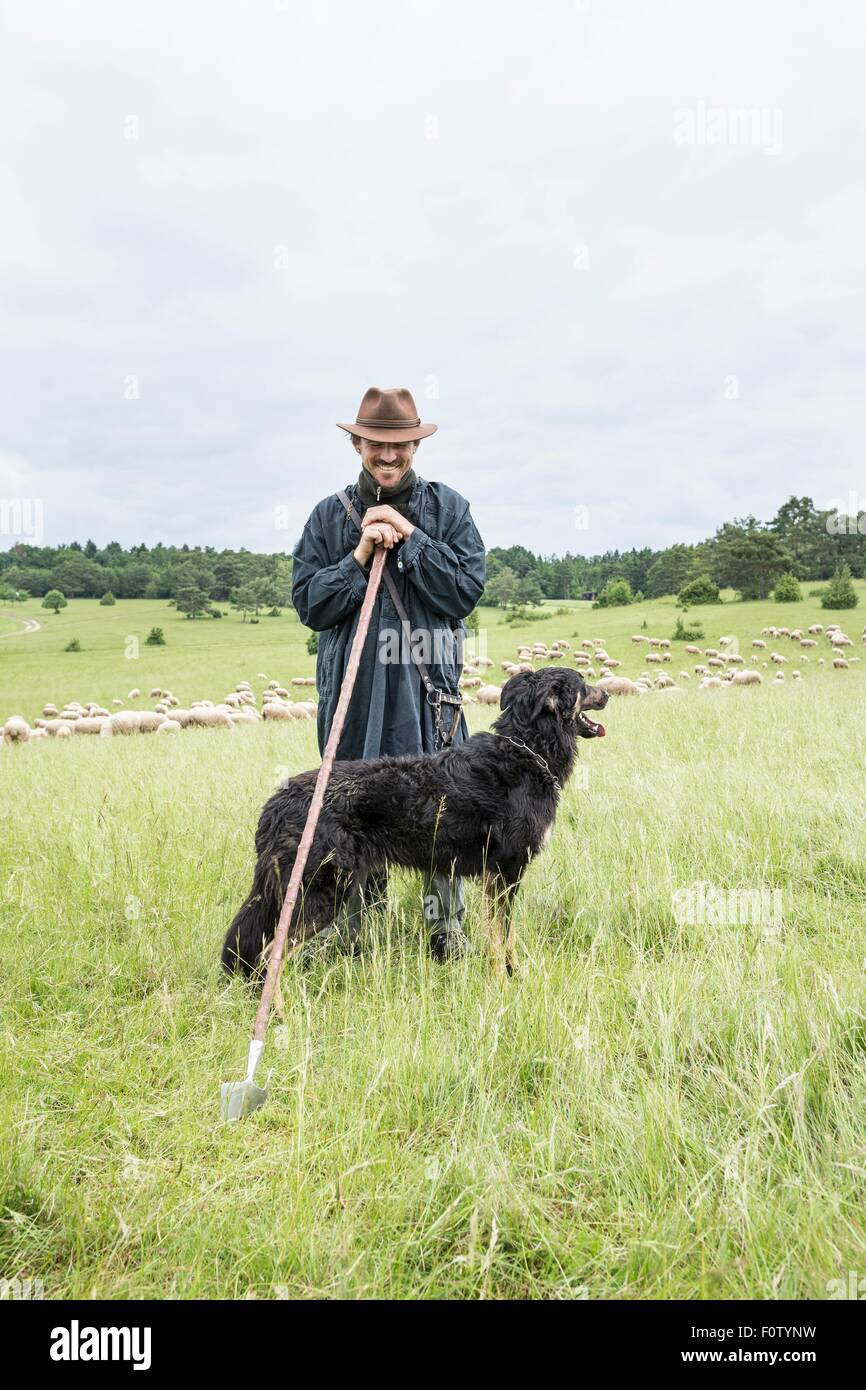 Portrait of farmer and sheepdog Stock Photo