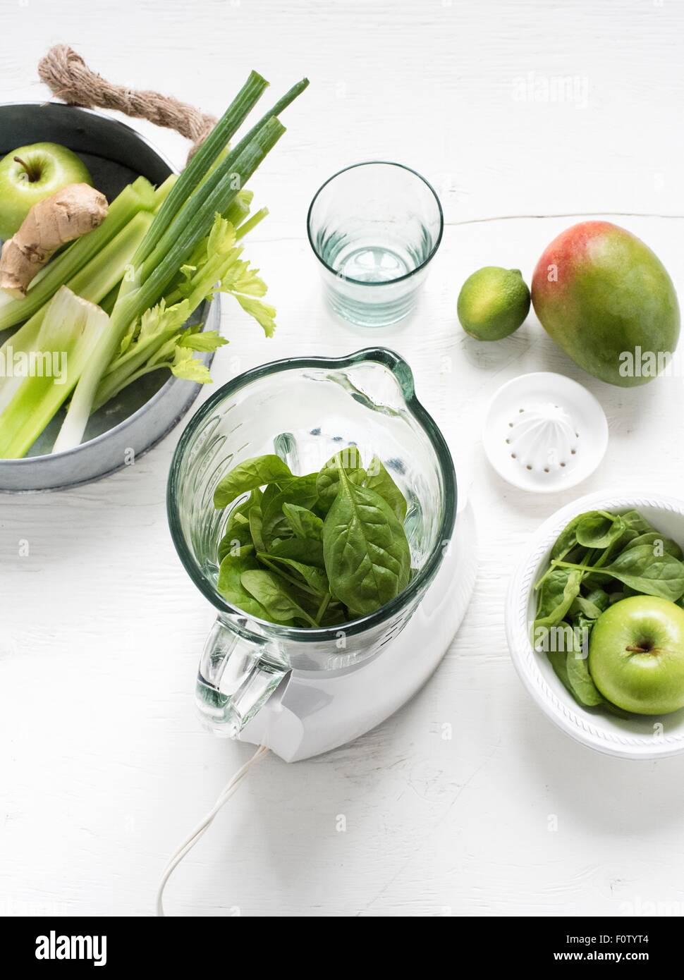 Blender with fresh green fruits and vegetables Stock Photo Alamy