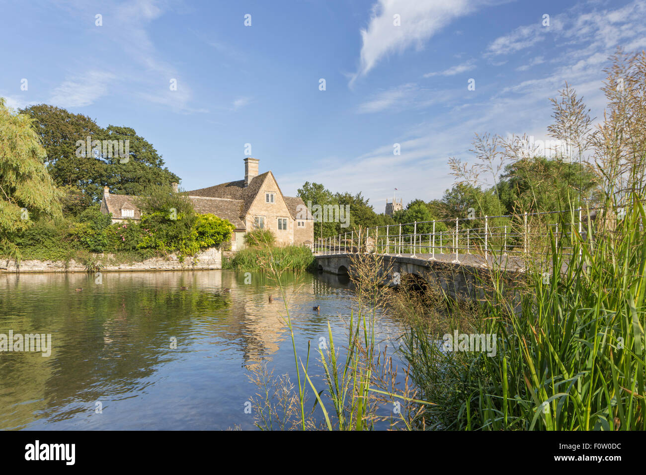 Fairford Mill on the River Coln, in the Cotswold market town of Fairford, Gloucestershire, England, UK Stock Photo