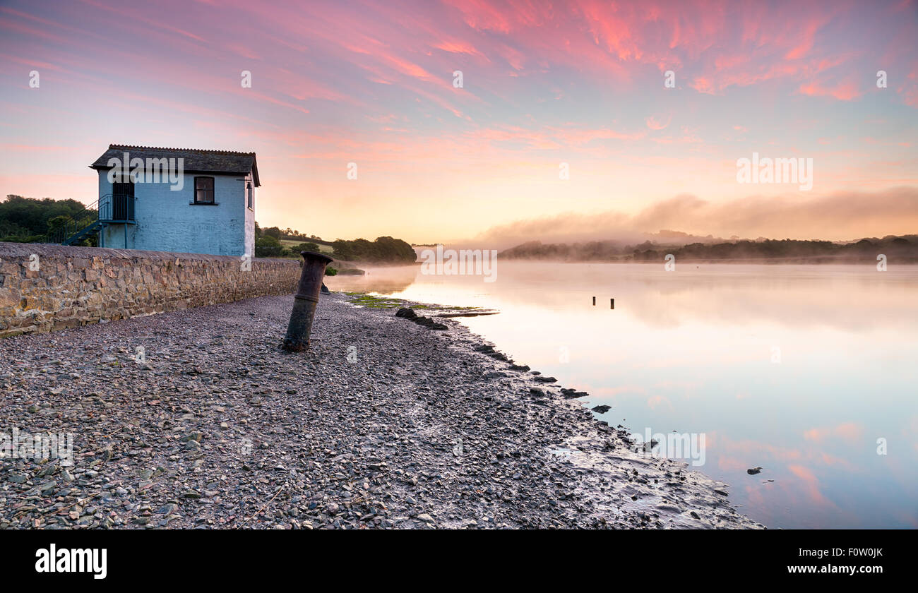 A misty sunrise at Halton Quay on the Cornwall side of the River Tamar Stock Photo