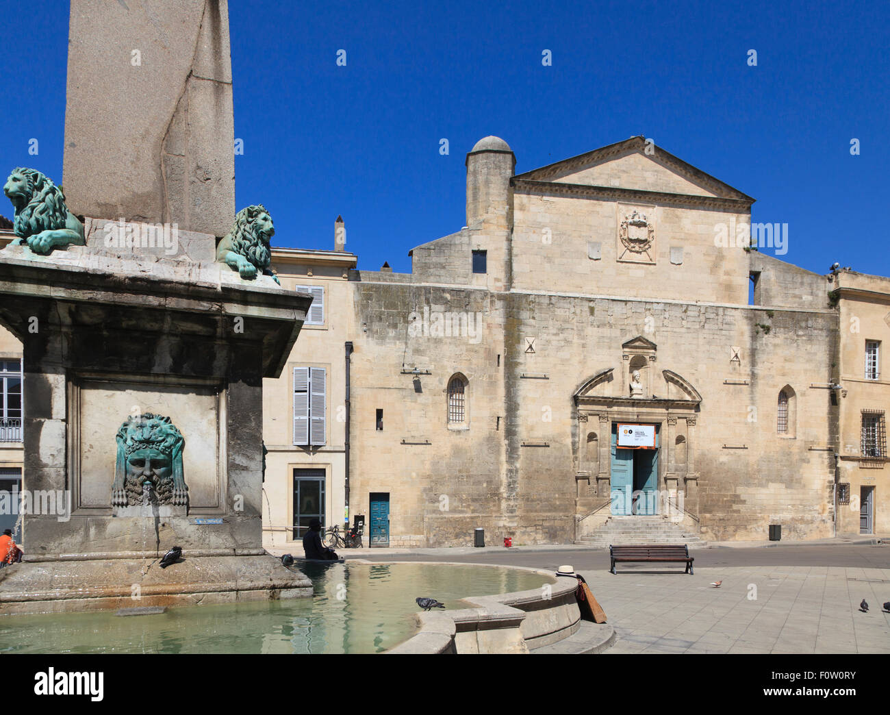 Fountain around the roman obelisk and the Musee d'Art Paien in the Place de la Republique Arles Stock Photo