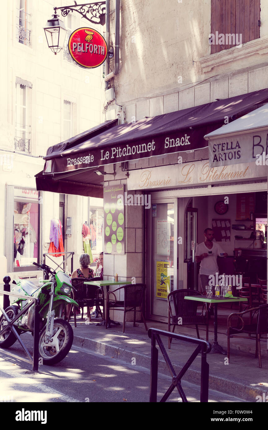 French street cafe with motorcycle outside Stock Photo