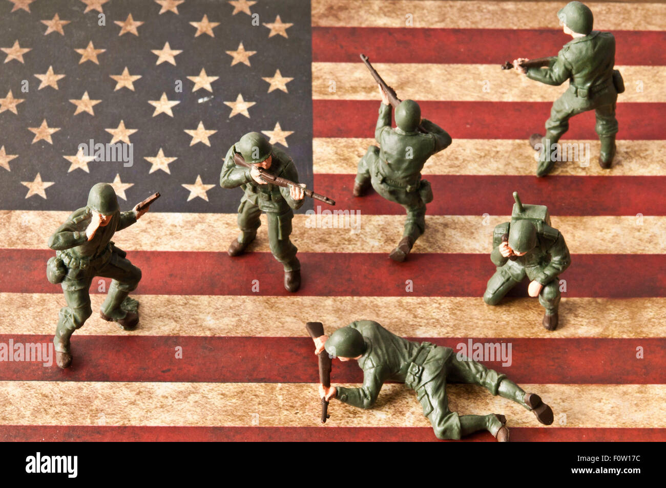 US troops toy soldiers replica of WWII and American flag, Memorial Day concept Stock Photo