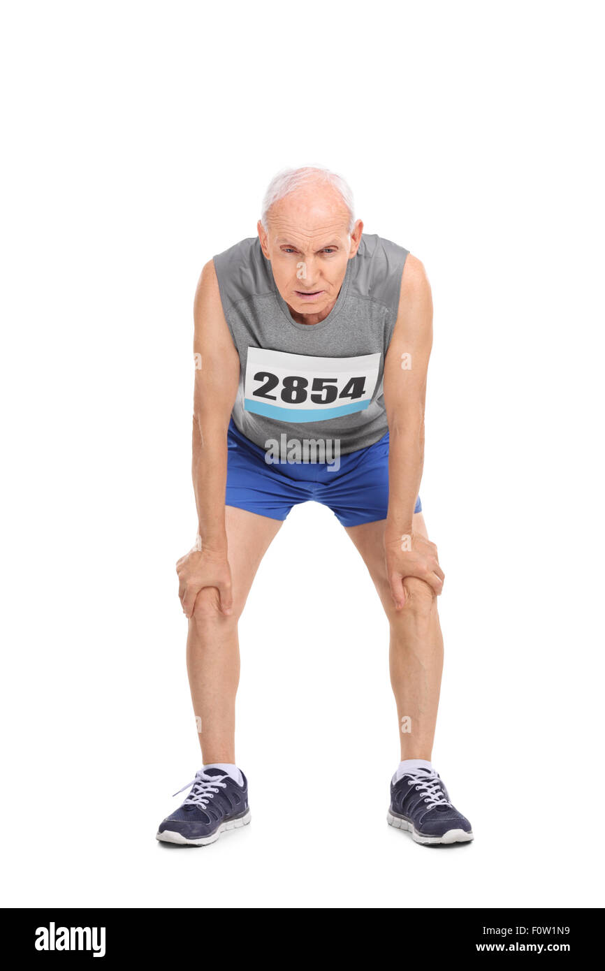 Full length portrait of an exhausted senior runner in sportswear isolated on white background Stock Photo