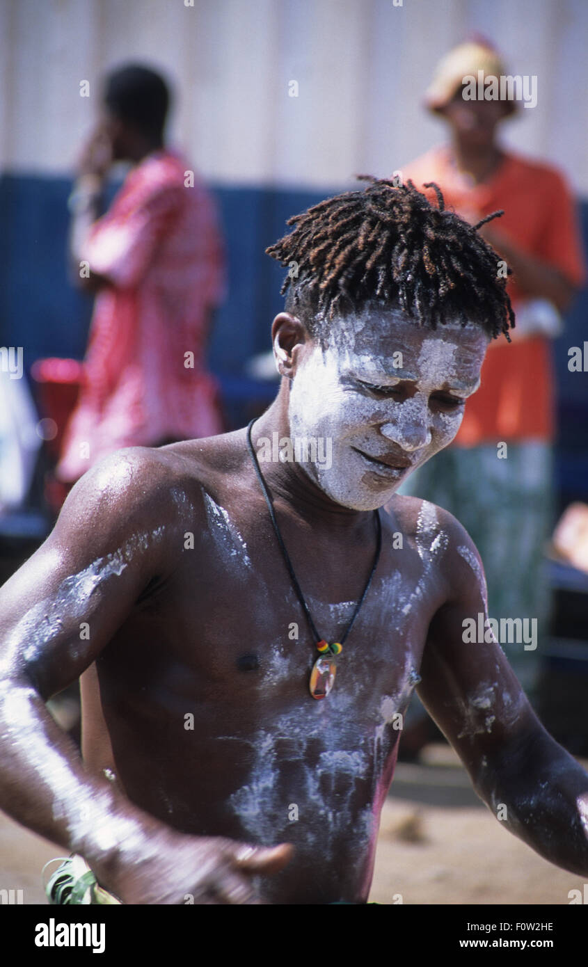 A Malagasy man with painted body doing a traditional dance in Andoany, or Hell-Ville, capital of Madagascar's most commercialised island, Nosy Be, Diana Region, Indian Ocean Stock Photo