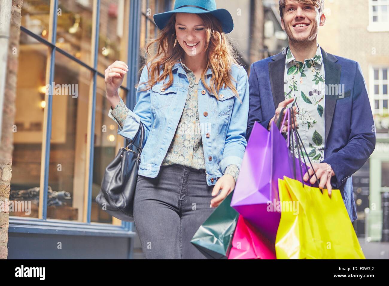 Stylish couple on shopping spree, London, UK Stock Photo