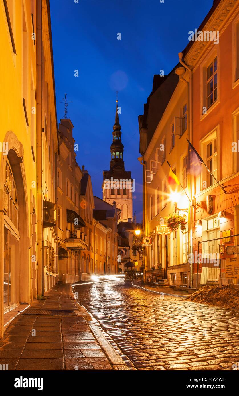 Street with view of St Olafs church at night, Tallinn, Estonia Stock Photo