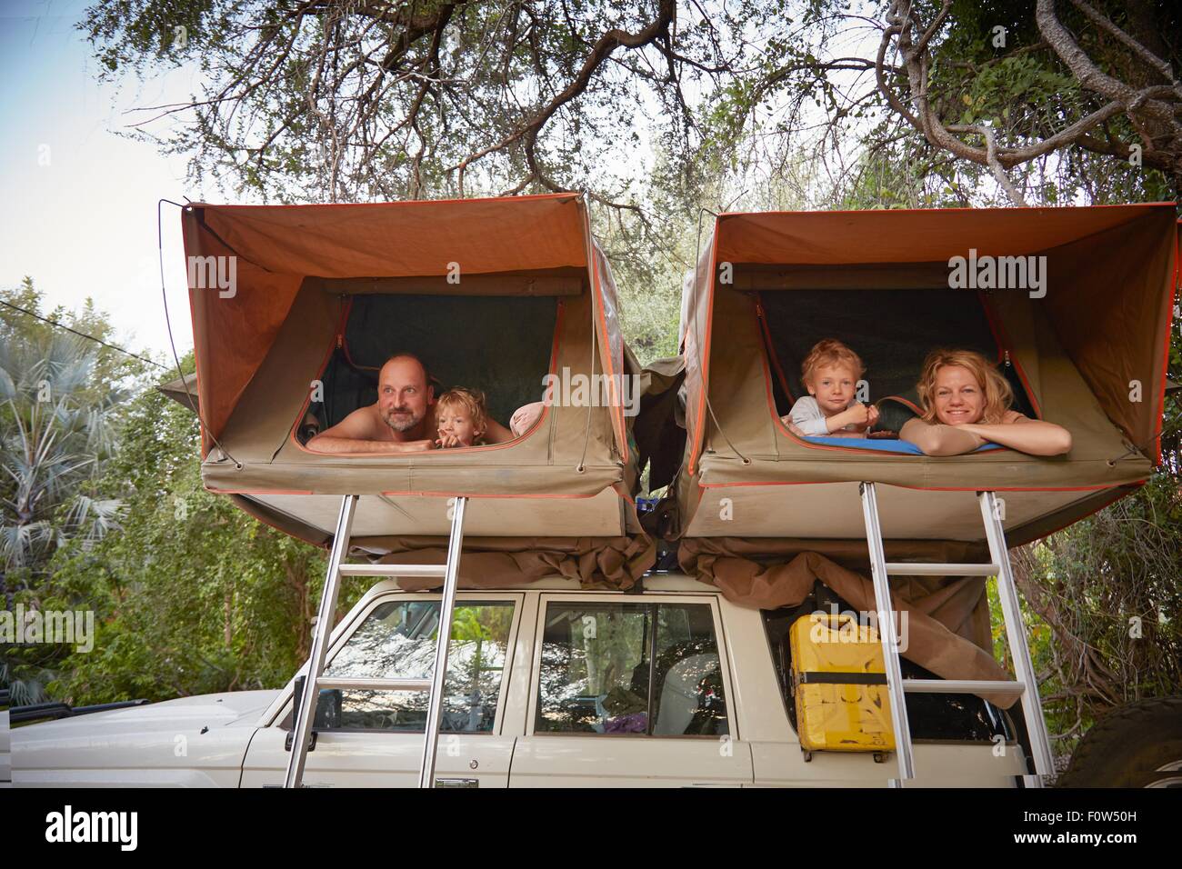 Family in sleeping tents on top of off road vehicle, Ruacana, Owamboland, Namibia Stock Photo