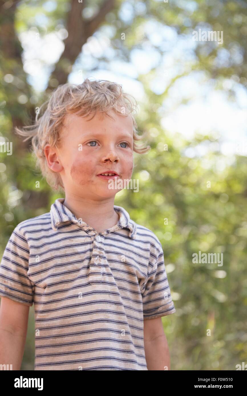 Portrait of young boy with dirty face Stock Photo