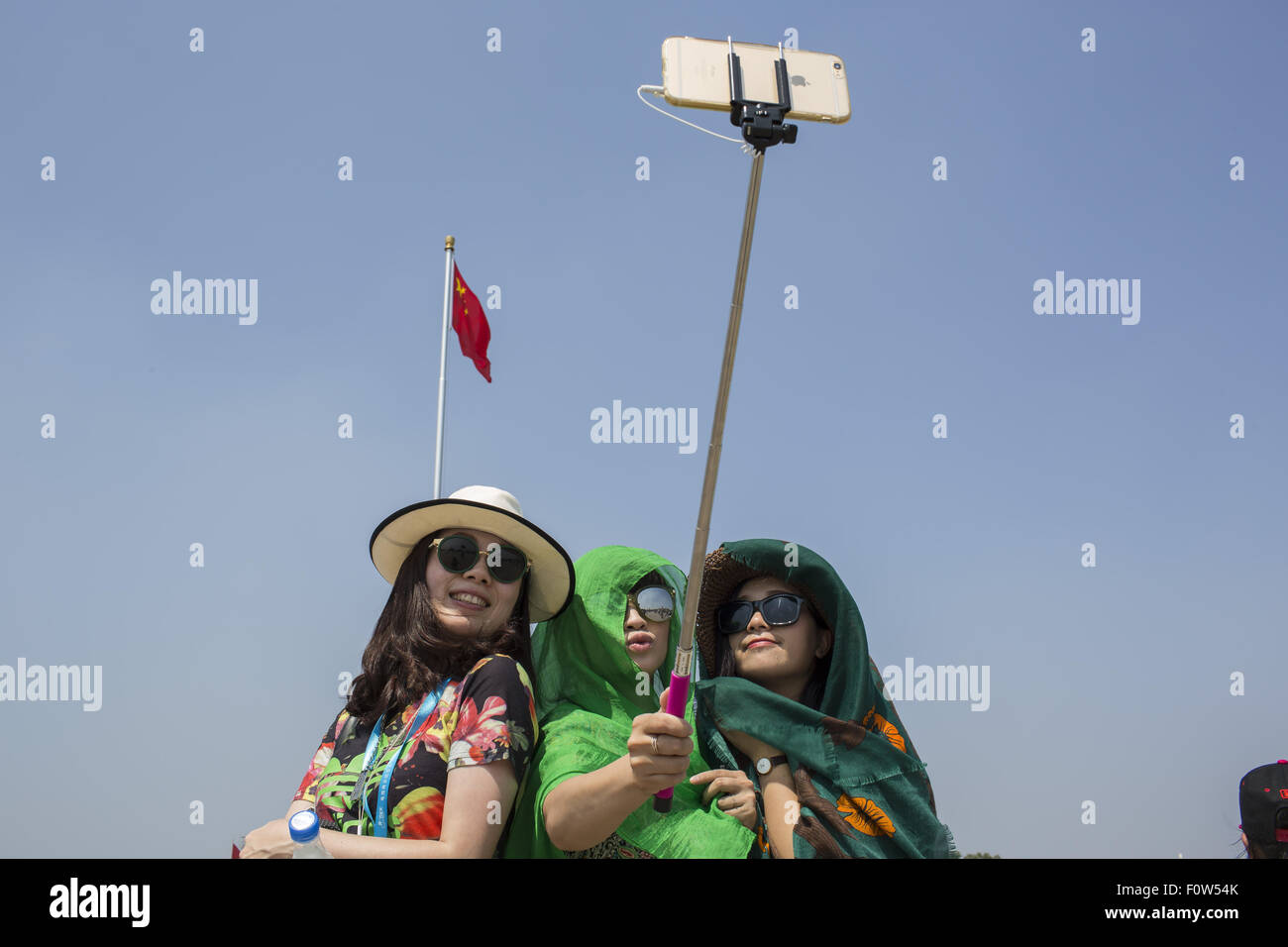 Beijing, China. 12th Aug, 2015. Grils take selfie at Tiananmen Square, Beijing, China. © Jiwei Han/ZUMA Wire/Alamy Live News Stock Photo