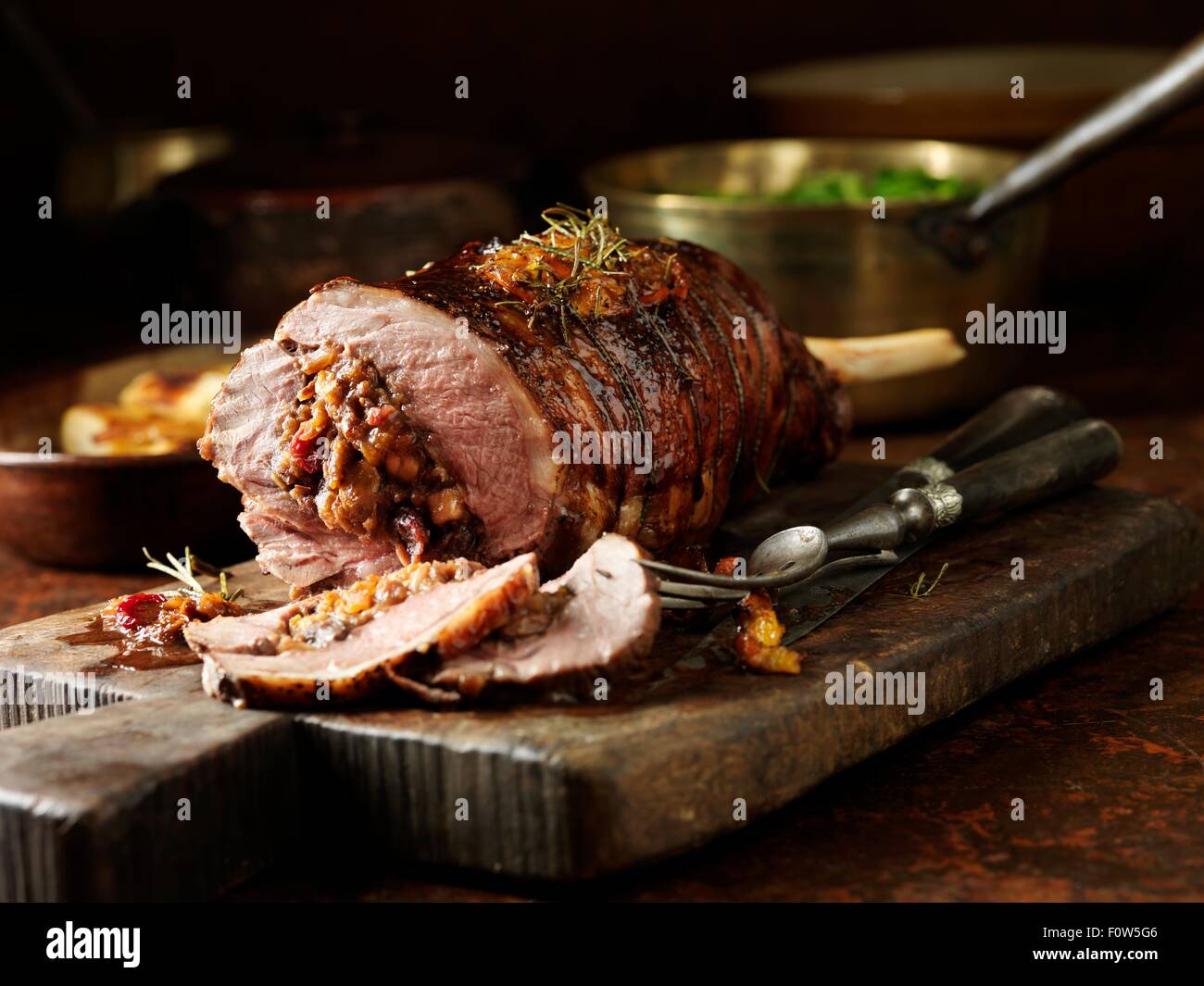Carved lamb leg with stuffing Stock Photo - Alamy