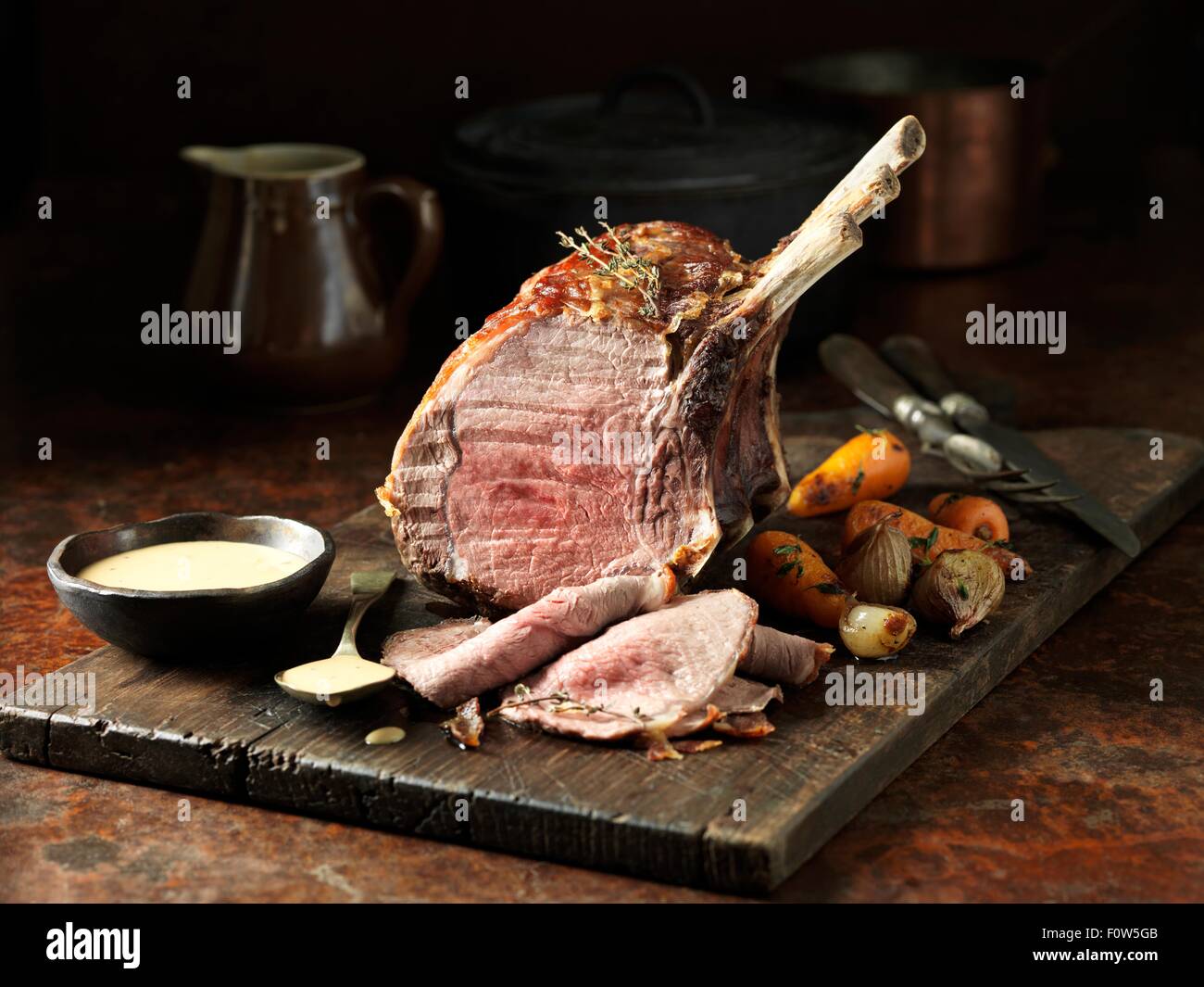 Veal bone in sirloin joint with parma ham and masala gravy Stock Photo