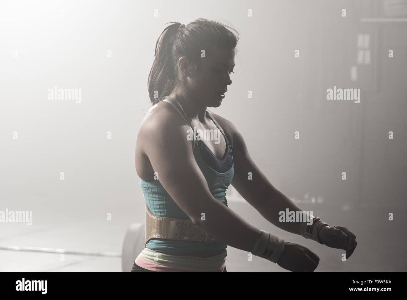 Young woman working out in gym Stock Photo
