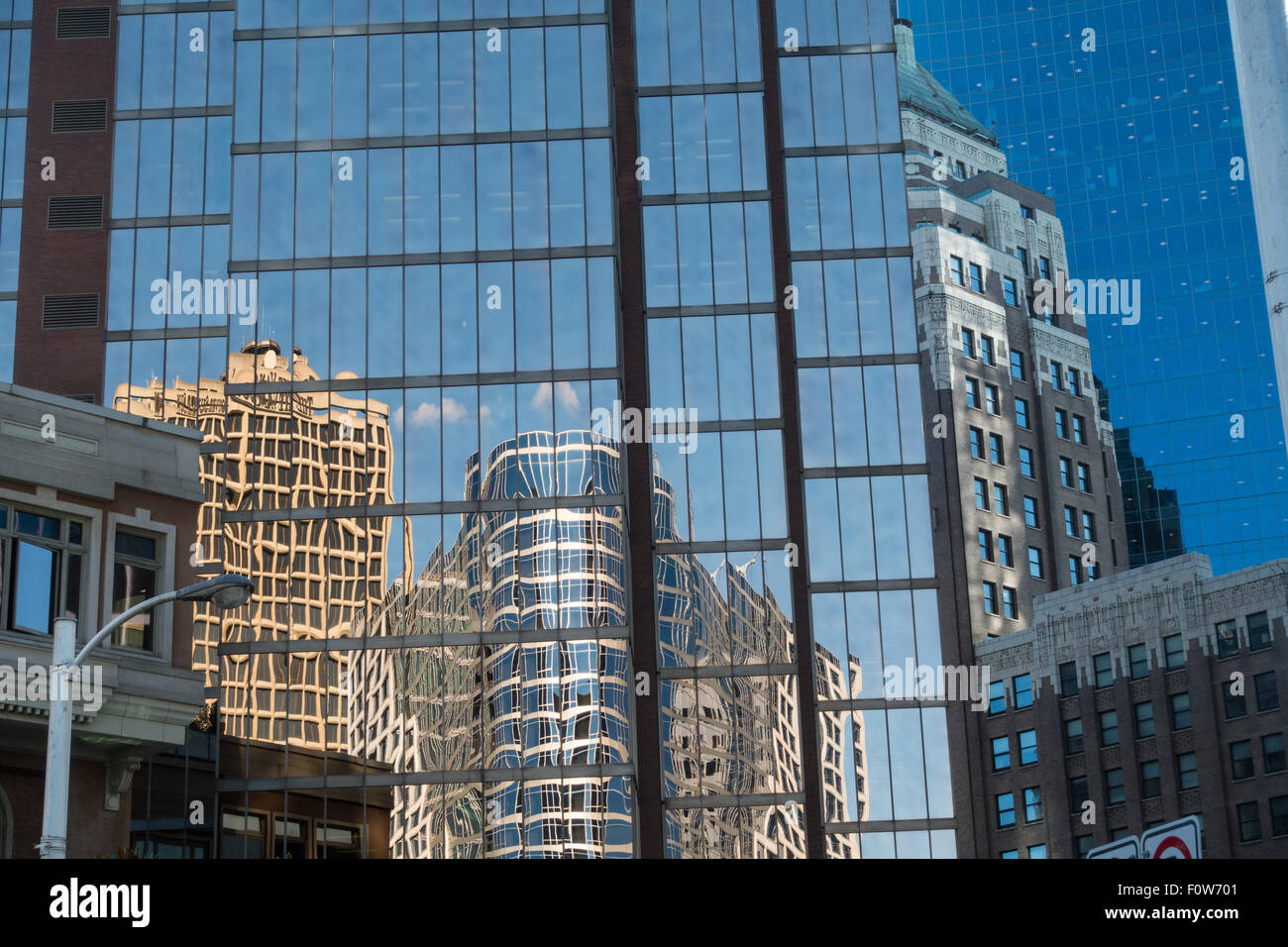 Buildings reflected in downtown Vancouver glass hirises Stock Photo
