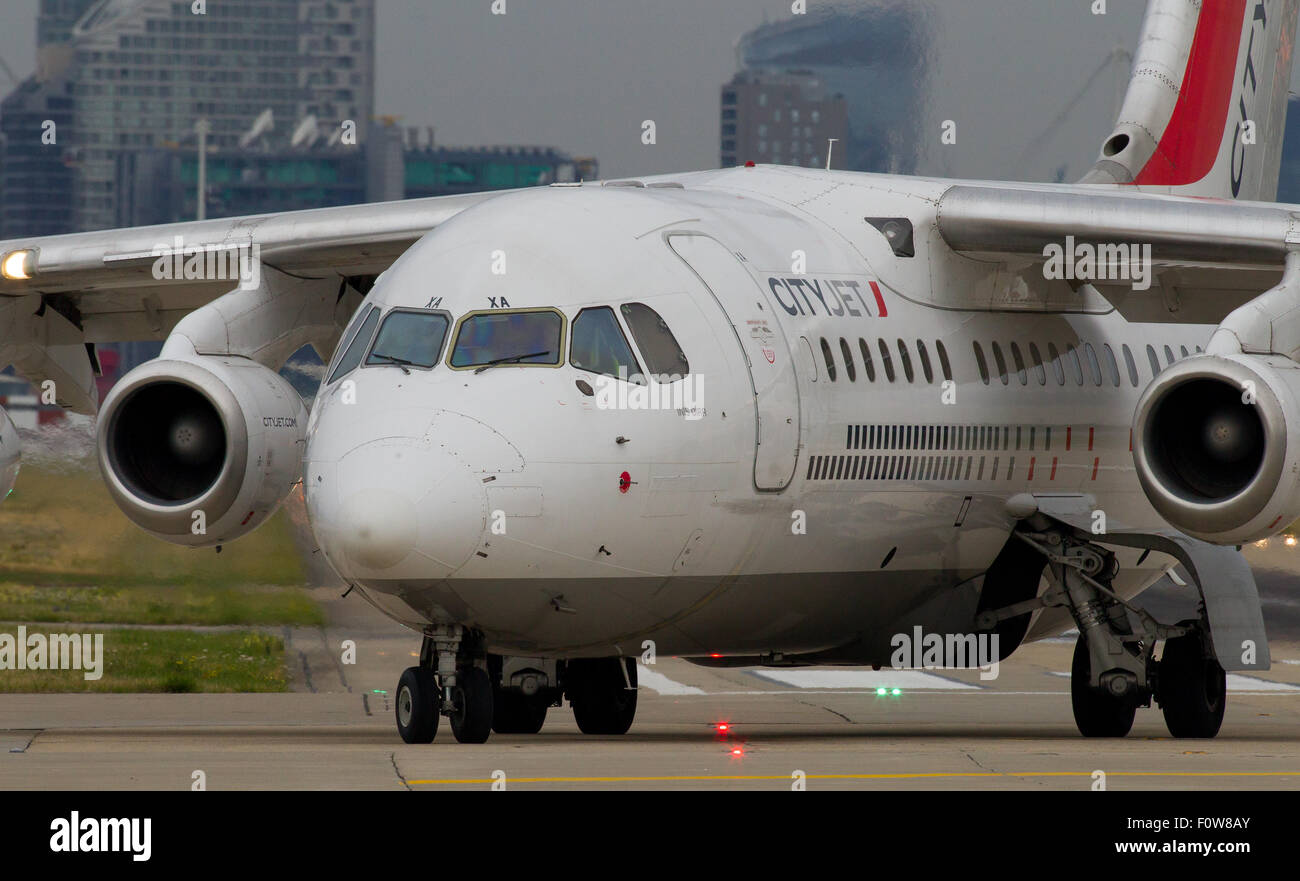 A CityJet Avro RJ85 registration EI-WXA taxis for take off at London City Airport LCY. Stock Photo