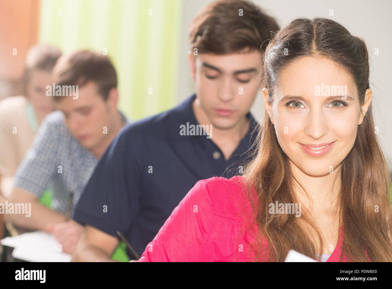 Students learning and smiling at college Stock Photo