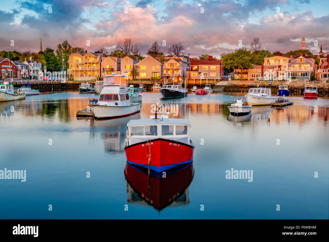 Rockport Harbor - Colorful fishing and pleasure boats docked at Bradley Wharf during first light at Rockport, Massachusetts. Stock Photo