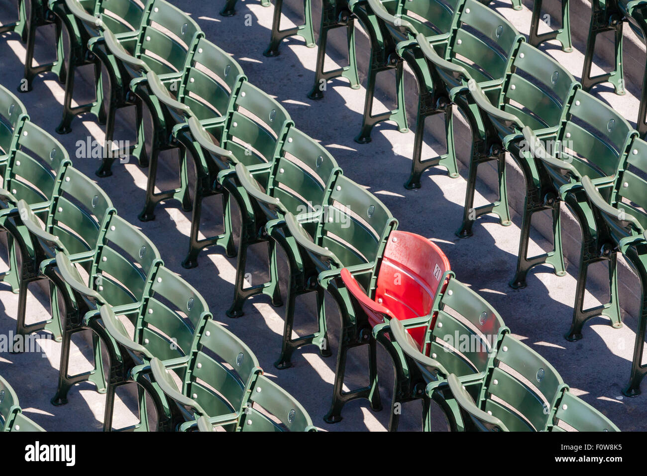 The lone red seat in the right field bleachers (Section 42, Row 37, Seat 21) signifies the longest home run ever hit at Fenway. The home run, hit by Ted Williams on June 9, 1946, was officially measured at 502 feet. Stock Photo