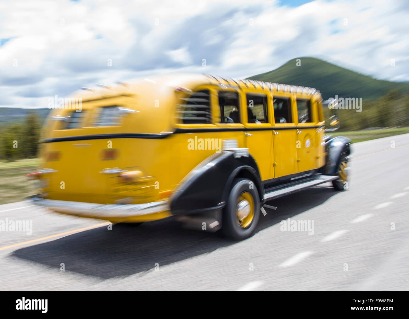 Motion blur of Yellowstone Tour Bus on the road in Lamar Valley, Yellowstone National park, Wyoming, USA Stock Photo