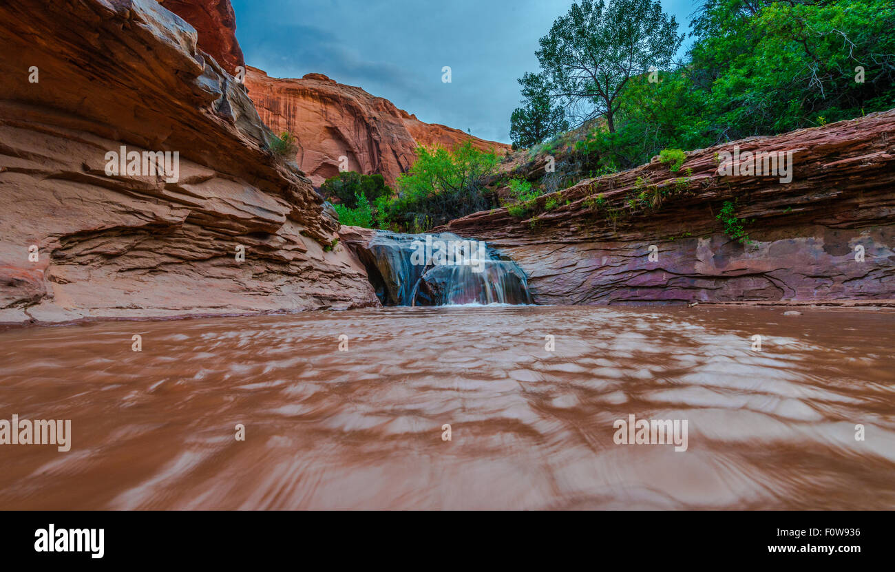 Stock Photo - Waterfall in Coyote Gulch part of Grand Staircase Escalante National Monument in southern Utah canyon country low Stock Photo