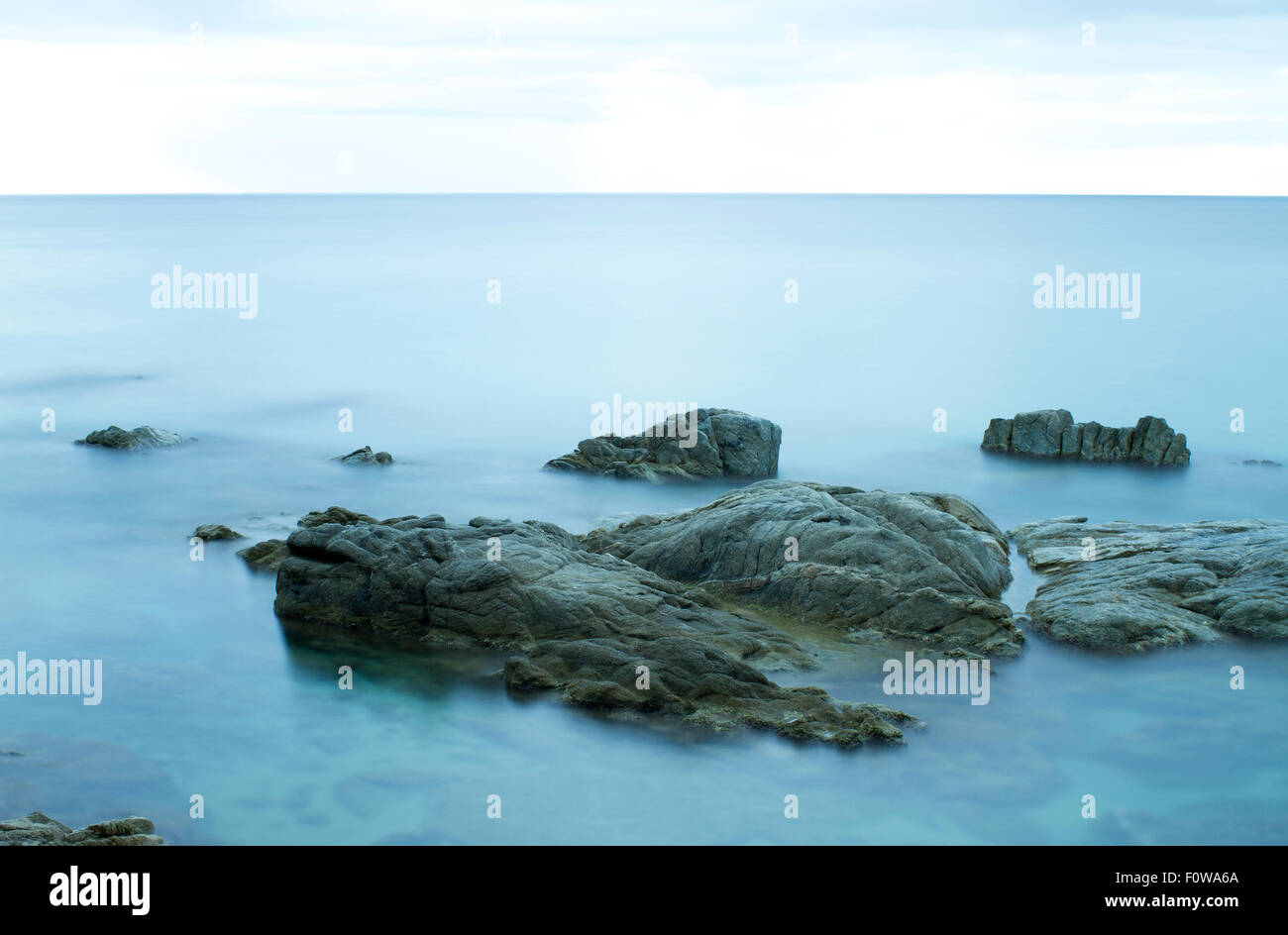 Beautiful rocky sea shore. Long exposure landscape. Costa Brava Spain Stock Photo