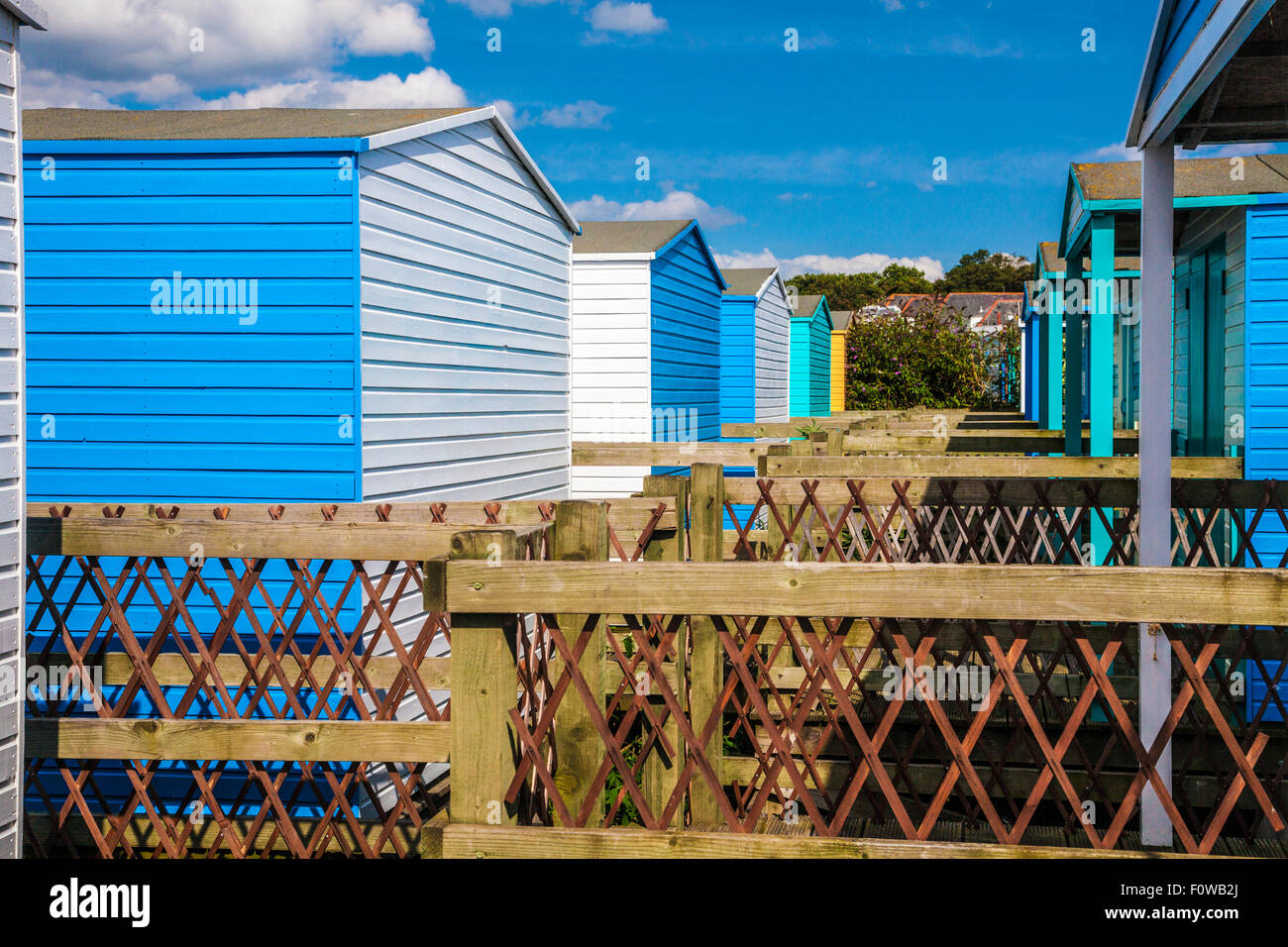 Colourful wooden beach huts in the Kentish coastal resort of Whitstable. Stock Photo