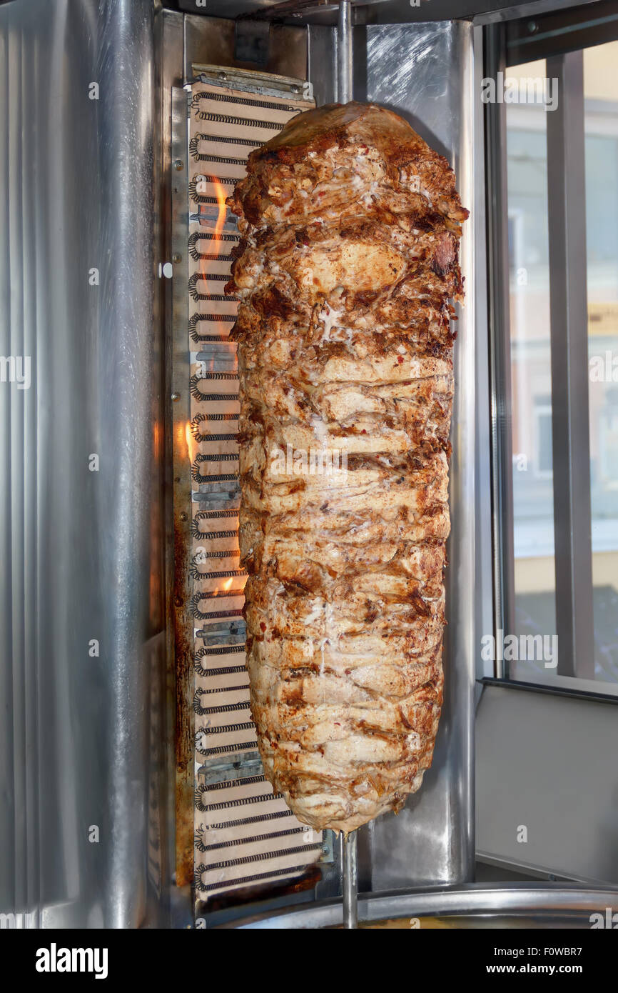 Shawarma meat being cut before making a sandwich Stock Photo
