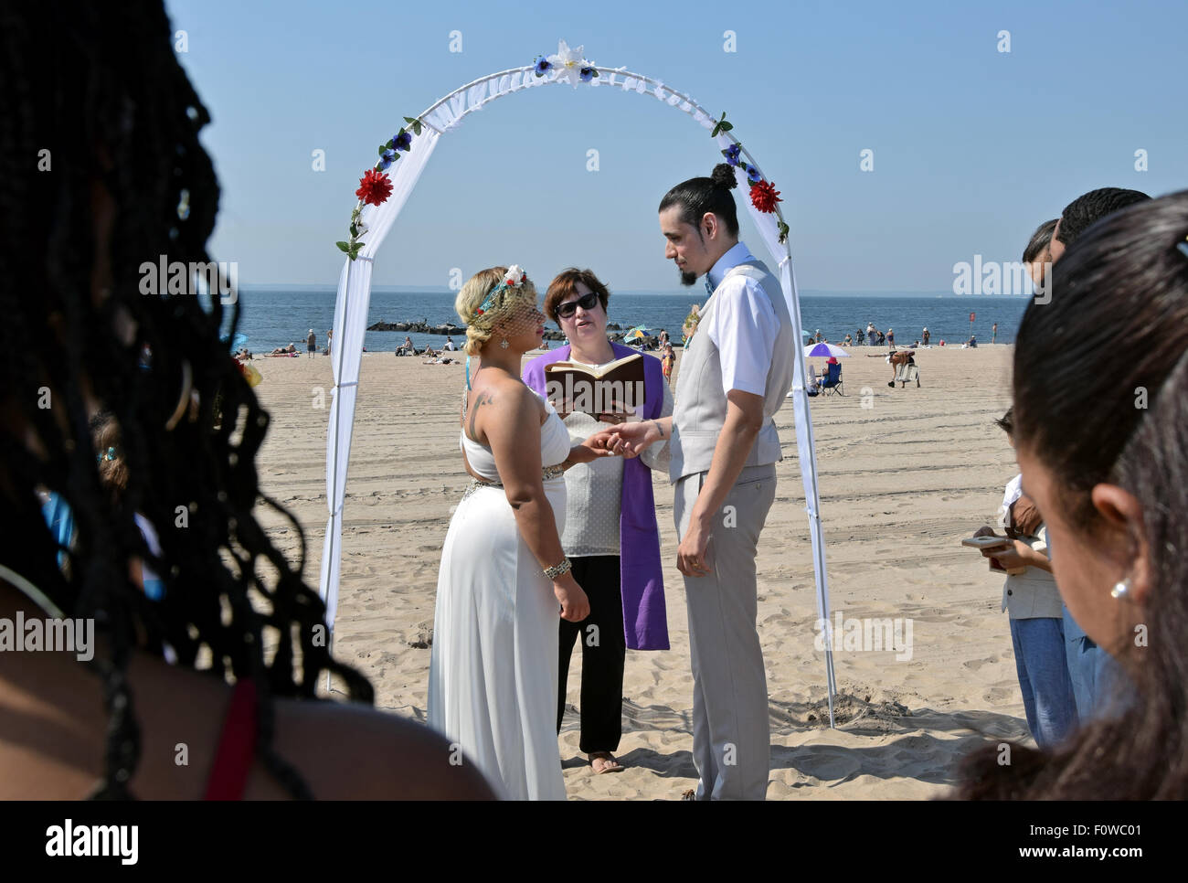 A couple getting married on the beach in Coney Island, Brooklyn, New York Stock Photo