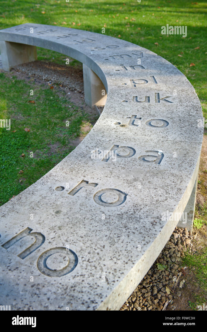 Section of circular stone bench with some of the worlds IP addresses (including .UK) cut in Stock Photo