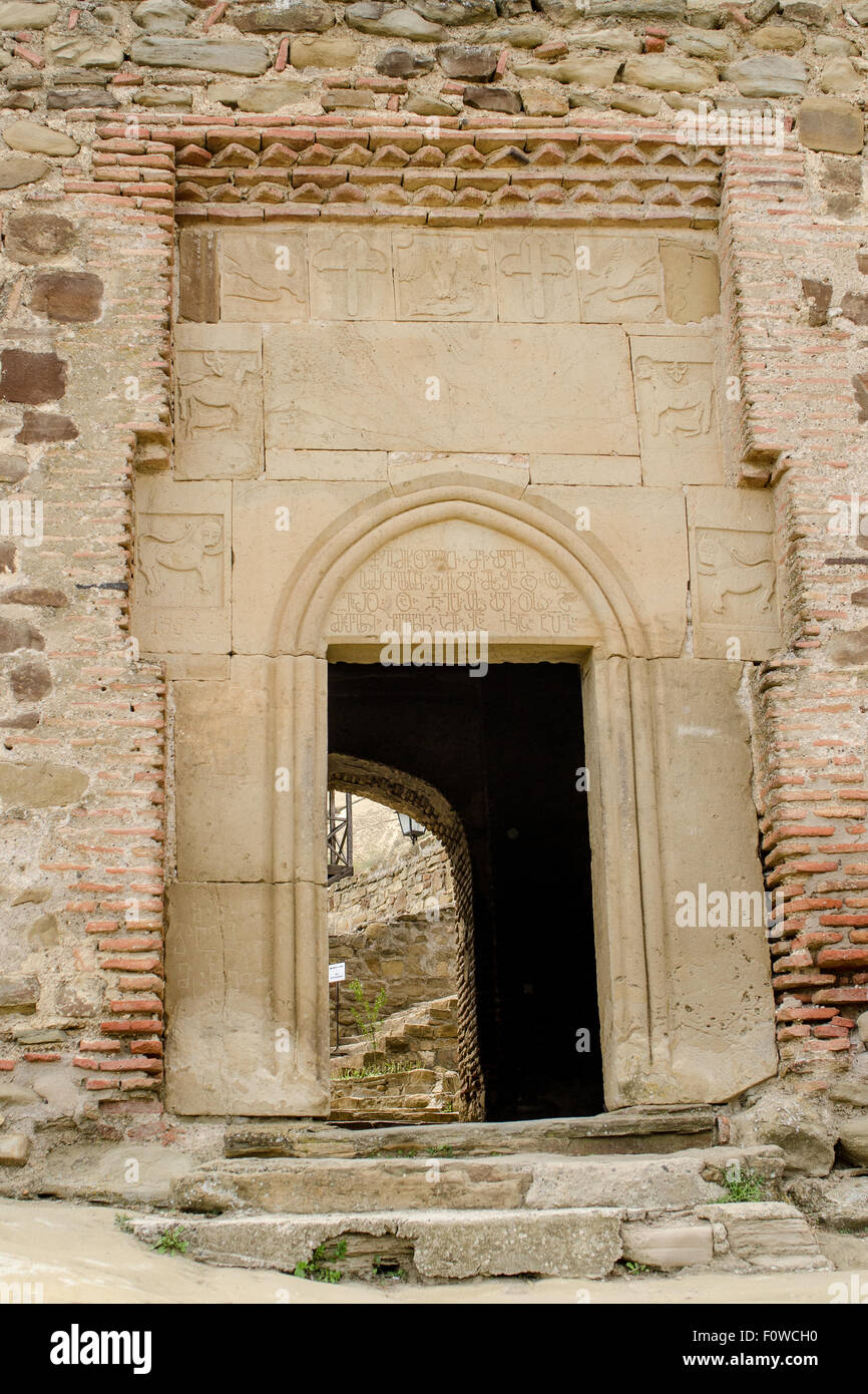 Ancient stone archway leads to historical ruins at a cultural heritage ...