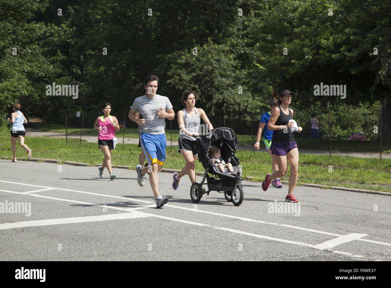People make jogging for health a family affair in Prospect Park, Brooklyn, NY. Stock Photo