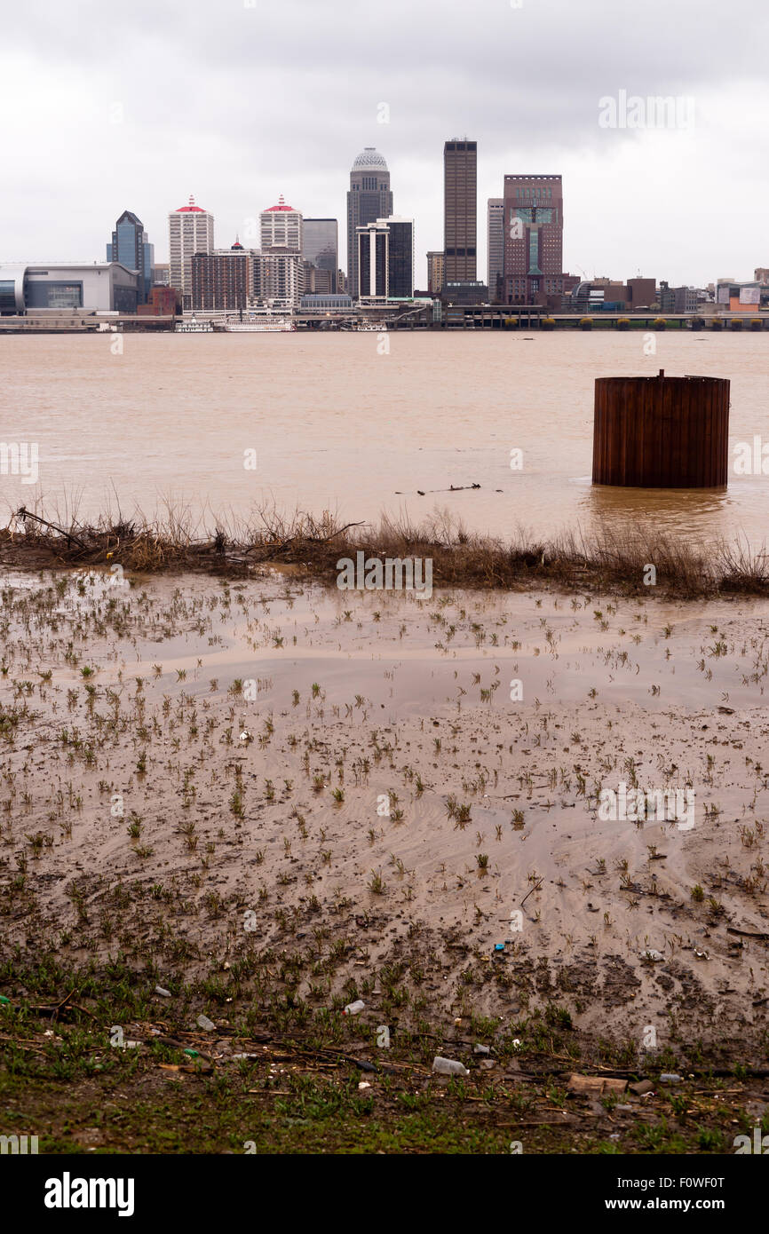 Spring rains flood the Ohio River banks along the shore of the largest city in Kentucky Stock Photo