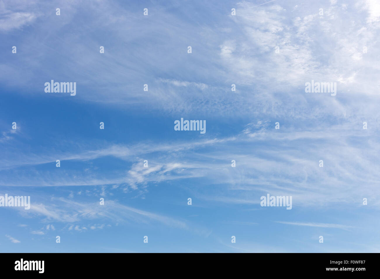 Blue sky and white fluffy clouds background Stock Photo - Alamy