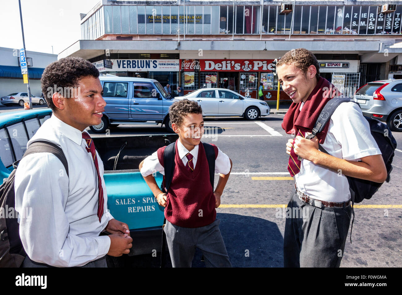 Cape Town South Africa,Woodstock,Victoria Road,Black Afro American,boy,teen teens teenager teenagers student students school uniform,friends,taking,SA Stock Photo