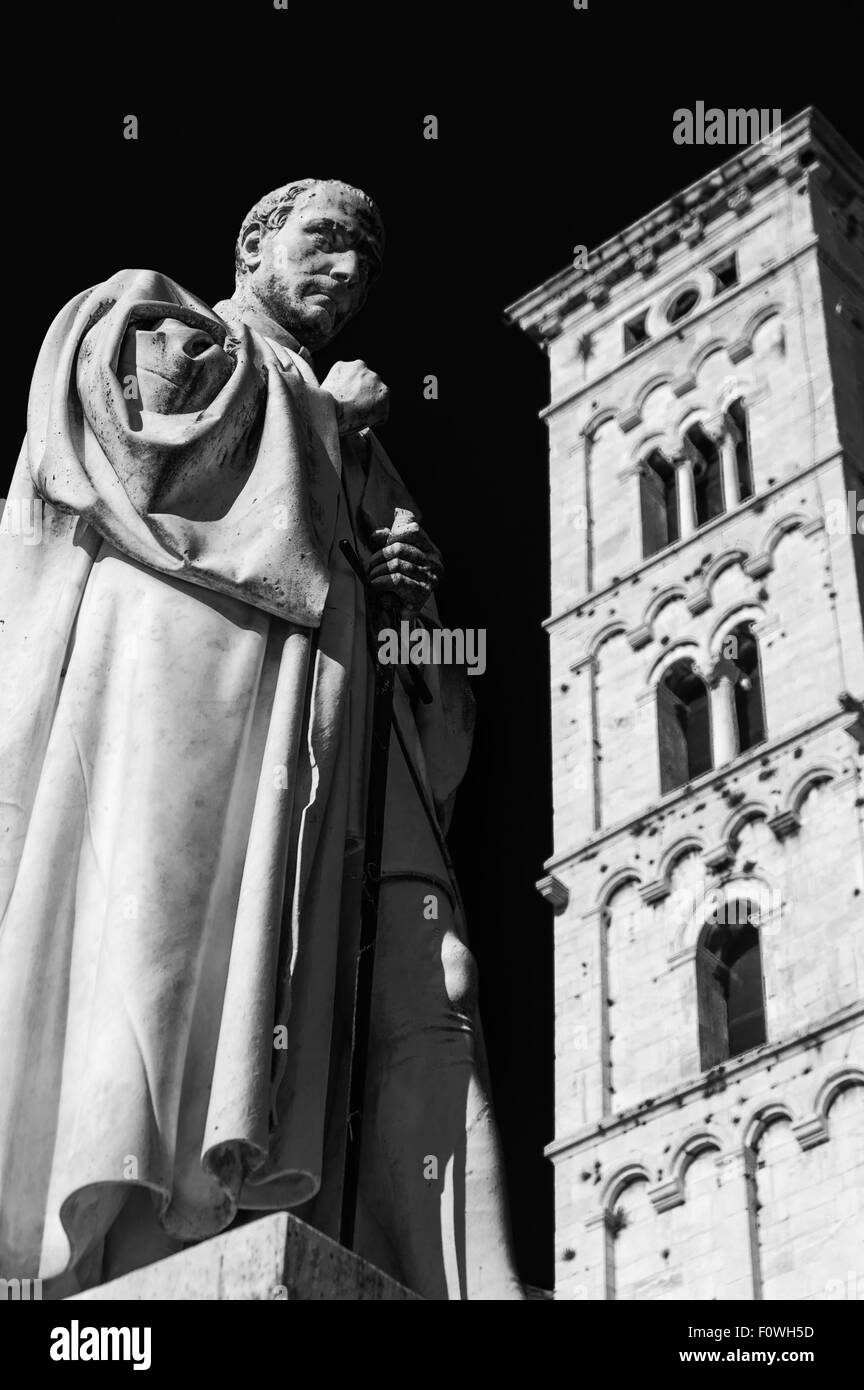 Lucca cathedral with statue in main square. Tuscany, Italy Stock Photo