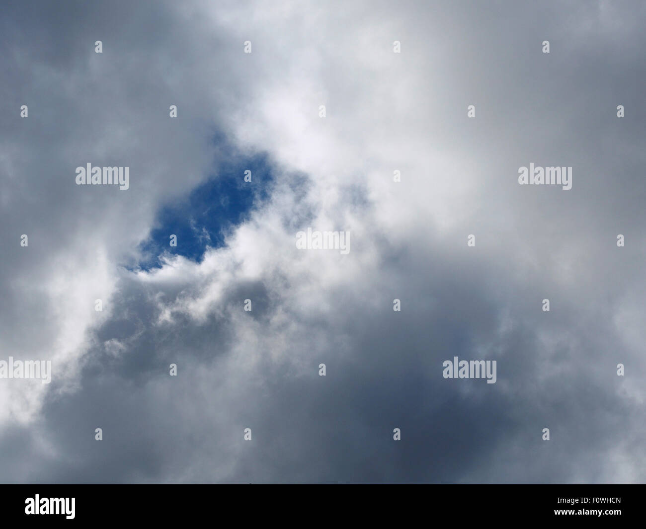 Blue patch of sky between clouds, Ystuvíkurfjall, near Akureyri Iceland Stock Photo