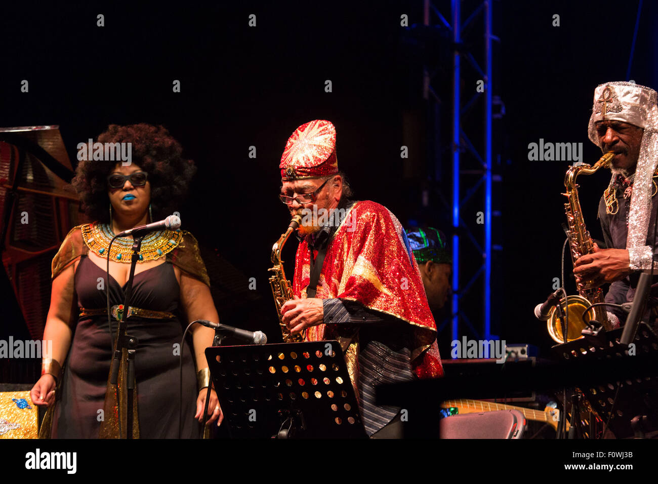 Glanusk Park near Brecon, Wales, 21st August 2015. The first day of The Green Man music festival in the Brecon Beacons Mountains in Wales. The crowds had to dodge the frequent rain storms throughout the day. Pictured: SUN RA ARKESTRA on the Far Out Stage. Credit: Rob Watkins/Alamy Live News Team Stock Photo