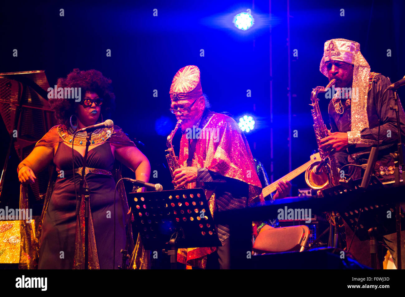 Glanusk Park near Brecon, Wales, 21st August 2015. The first day of The Green Man music festival in the Brecon Beacons Mountains in Wales. The crowds had to dodge the frequent rain storms throughout the day. Pictured: SUN RA ARKESTRA on the Far Out Stage. Credit: Rob Watkins/Alamy Live News Team Stock Photo