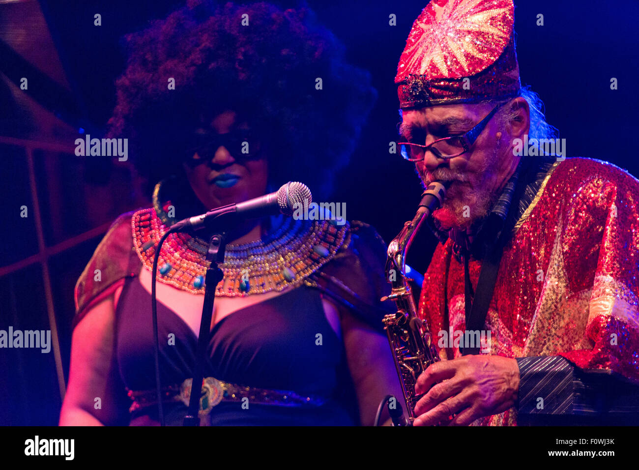 Glanusk Park near Brecon, Wales, 21st August 2015. The first day of The Green Man music festival in the Brecon Beacons Mountains in Wales. The crowds had to dodge the frequent rain storms throughout the day. Pictured: SUN RA ARKESTRA on the Far Out Stage. Credit: Rob Watkins/Alamy Live News Team Stock Photo