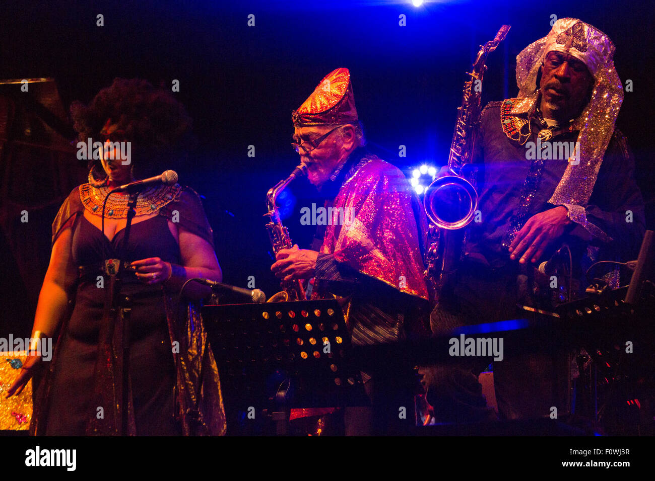 Glanusk Park near Brecon, Wales, 21st August 2015. The first day of The Green Man music festival in the Brecon Beacons Mountains in Wales. The crowds had to dodge the frequent rain storms throughout the day. Pictured: SUN RA ARKESTRA on the Far Out Stage. Credit: Rob Watkins/Alamy Live News Team Stock Photo