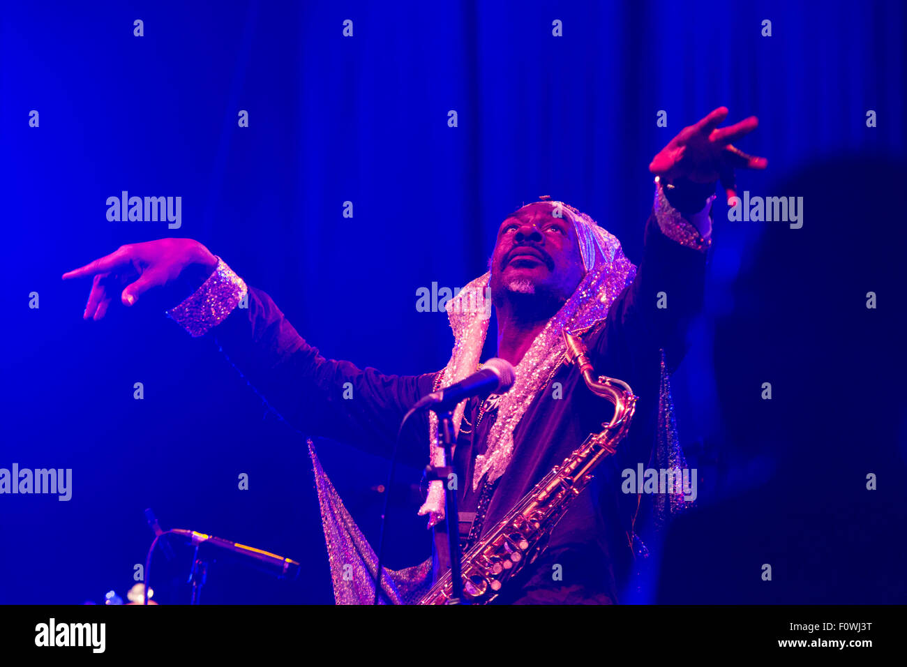 Glanusk Park near Brecon, Wales, 21st August 2015. The first day of The Green Man music festival in the Brecon Beacons Mountains in Wales. The crowds had to dodge the frequent rain storms throughout the day. Pictured: SUN RA ARKESTRA on the Far Out Stage. Credit: Rob Watkins/Alamy Live News Team Stock Photo